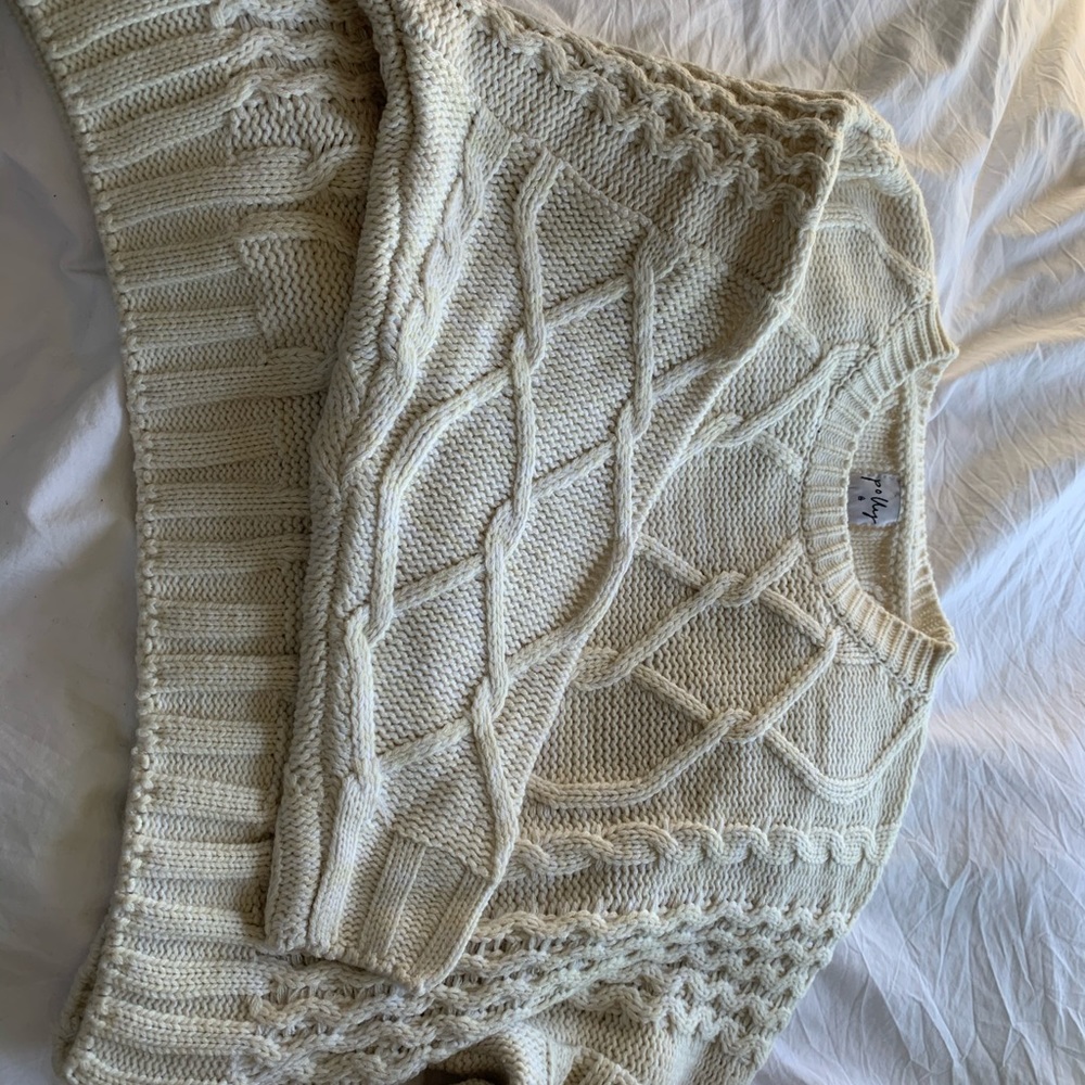 Cropped cable knit sweater